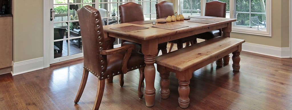 A solid-wood dining table with hand-turned legs